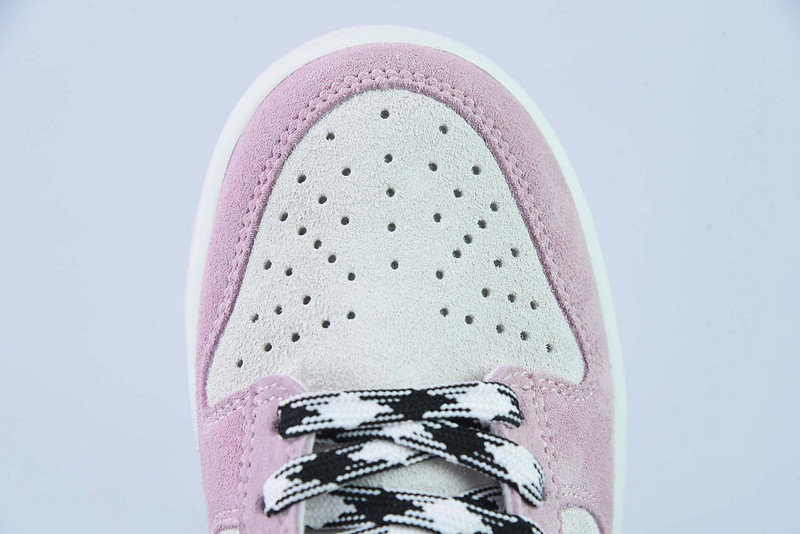 the nike dunk low appears in pink and grey suede dv3054-600